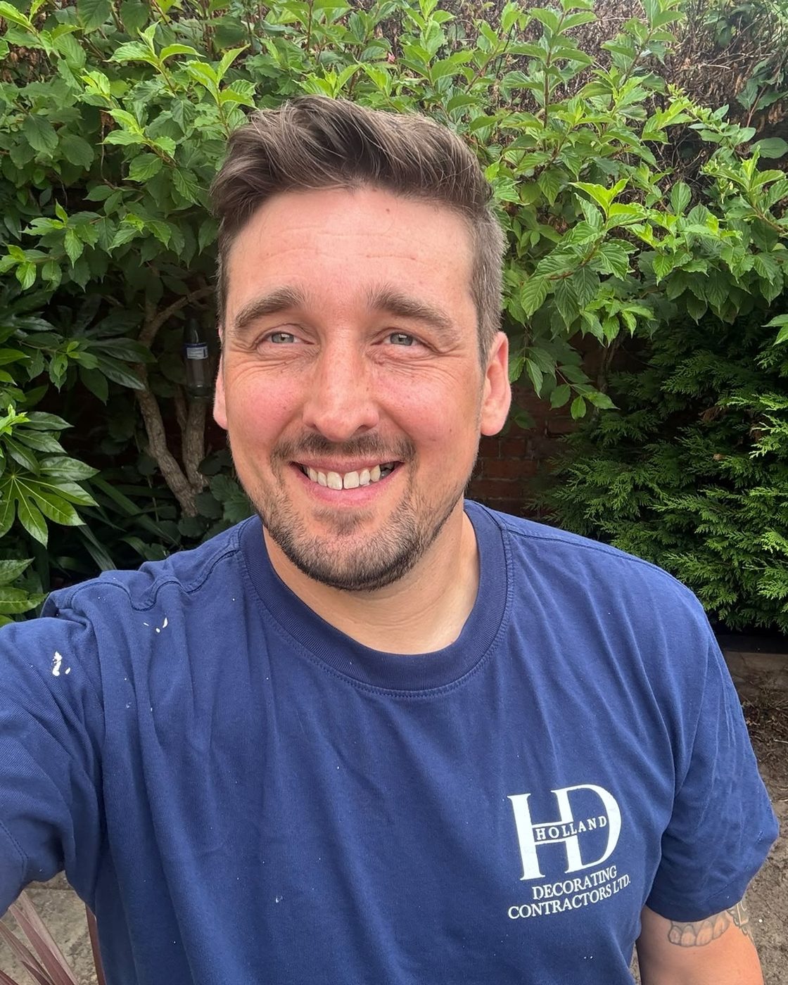 Ryan, founder of BrushDesk, in his Holland Decorating workwear